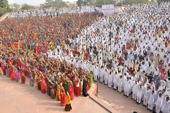 Thousands of people filling a ground shoulder to shoulder during a
              record attempt in Jaipur