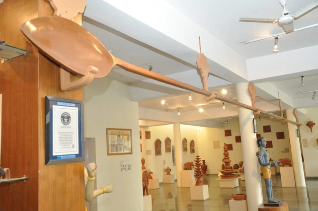 The carved wooden spoon on display at the Alankar Museum